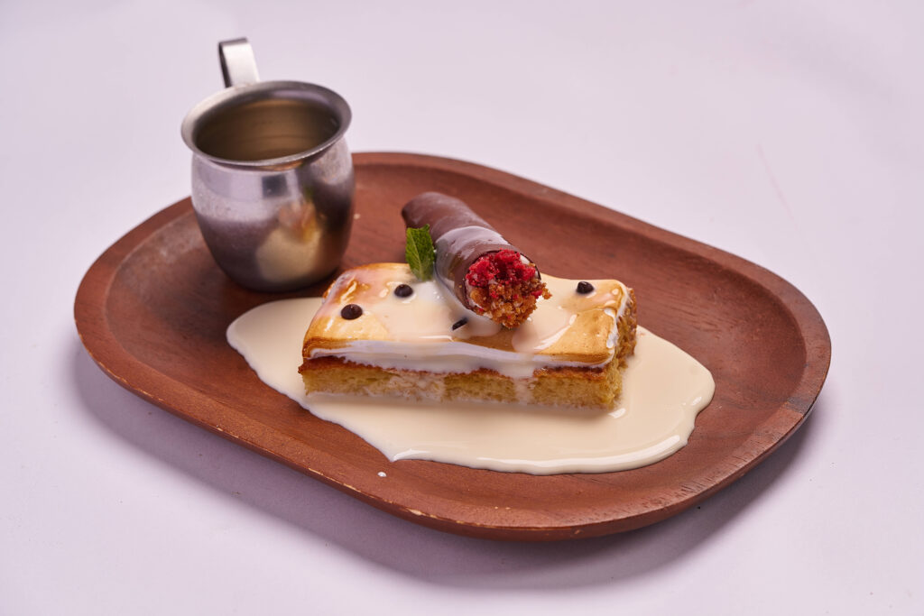 Classic Tres Leches cake soaked in condensed milk, served at Havana 1957 as the best authentic Cuban dessert in Miami